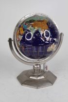 A lacquered hardstone inset terrestrial table globe on a chromed octagonal base, height 35cm