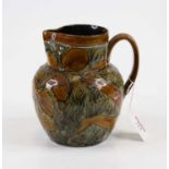 A Doulton Lambeth stoneware jug, relief decorated with foliage, numbered 9184, height 16cm