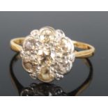 A yellow and white metal diamond circular cluster ring, comprising seven Old European cut diamonds