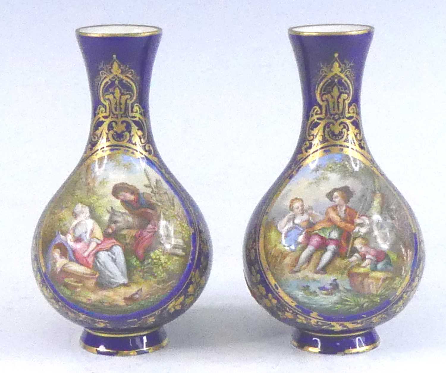 A pair of Sevres porcelain vases, 19th century, each decorated with children in 18th century dress
