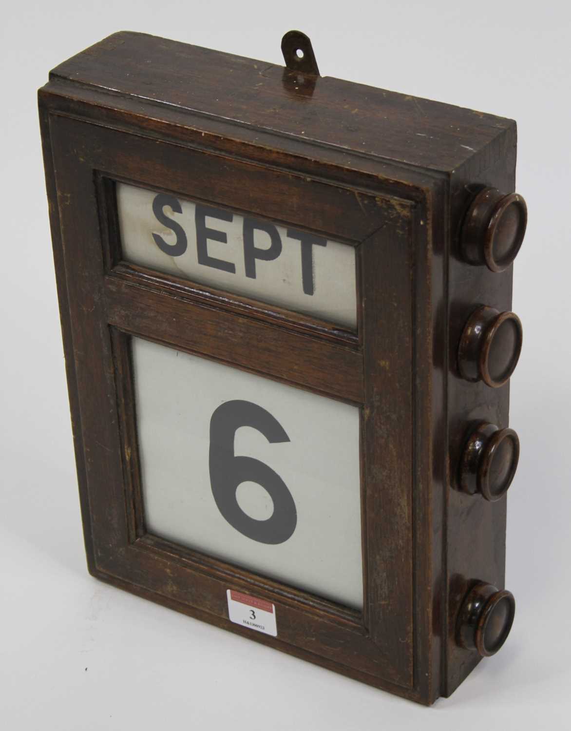 An early 20th century mahogany cased perpetual wall calendar, 30 x 24cm Linen rolls work and - Image 2 of 2