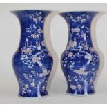 A pair of Chinese blue and white porcelain vases, each decorated in the Prunus pattern, h.38cm Large