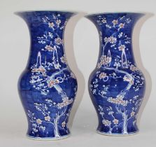 A pair of Chinese blue and white porcelain vases, each decorated in the Prunus pattern, h.38cm Large