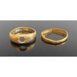 An 18ct gold ring (cut and stone removed), 5.3g; together with a 22ct gold wedding band (cut), 1.