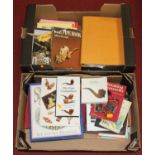 Two boxes of books relating to pipes and smoking accessories