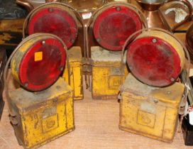 A set of four vintage road lamps, each h.30cm