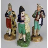 A Staffordshire theatrical pottery figure of a bullfighter, h.29cm; together with two others (3) All