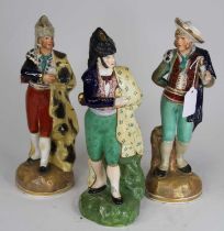 A Staffordshire theatrical pottery figure of a bullfighter, h.29cm; together with two others (3) All