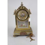 A Napoleon III style brass cased mantel clock, case surmounted by pineapple finial, the dial with