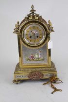 A Napoleon III style brass cased mantel clock, case surmounted by pineapple finial, the dial with