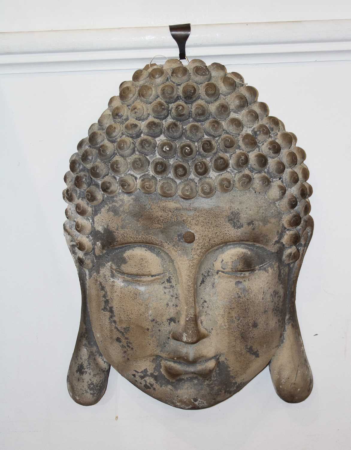 A composition wall mask of an Eastern deity, h.55cm