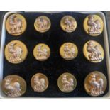 A cased set of Benson & Clegg brass and metal dress buttons