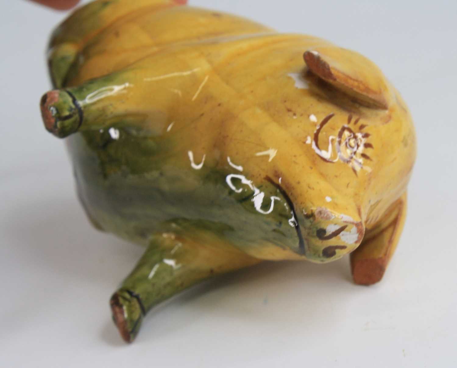 An Ewenny pottery piggy bank, shown in seated pose, having a mottled yellow and green glaze and - Image 3 of 5