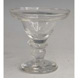 A glass sweetmeat, 18th century style, the pan topped round funnel bowl above a flattened knop and