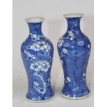 A pair of Chinese blue & white porcelain vases in the Prunus pattern, each of inverse baluster shape