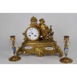 An early 20th century French gilt metal three-piece figural clock garniture having an enamel dial