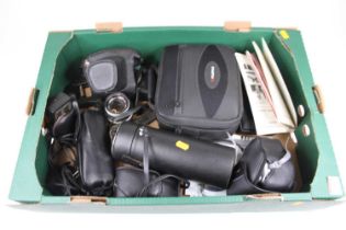 A collection of photography equipment to include a Pentax SP500 SLR camera and an Auto Tamron zoom