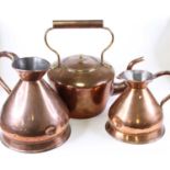 A Victorian copper range kettle, h.35cm; together with two victorian copper measuring jugs, the