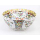 A Chinese export bowl, enamel decorated with flowers within a border of flowers and goldfish, dia.