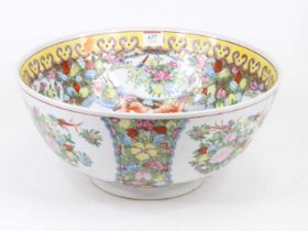 A Chinese export bowl, enamel decorated with flowers within a border of flowers and goldfish, dia.