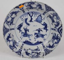 A Chinese blue and white porcelain dish, Kangxi period, decorated with warriors, six character