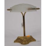 An Art Nouveau style brass desk lamp, having a frosted glass shade, h.34cm