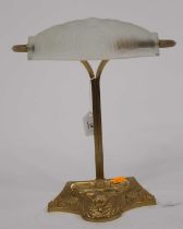 An Art Nouveau style brass desk lamp, having a frosted glass shade, h.34cm