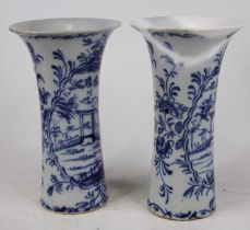 A pair of Delft sleeve vases, each having a flared rim, underglaze decorated with a bridge in a