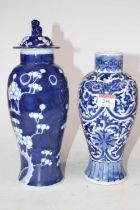 A Chinese porcelain vase and cover in the blue & white Prunus pattern, the cover surmounted by a Dog