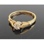 An 18ct gold diamond solitaire ring, the claw set round cut weighing approx 0.15 carats, 2.5g,
