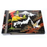 A Japanese musical lacquered photograph album (lacking contents)