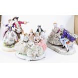 A collection of four German porcelain figure groups, each shown in 18th century dress, the largest