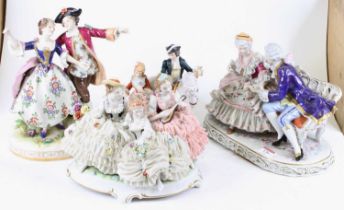 A collection of four German porcelain figure groups, each shown in 18th century dress, the largest