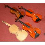 A Primavera student's violin together with two others, and one unfinished example (4)