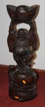 An Asian carved hardwood figure of Buddha, h.71cm