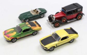 A collection of four various boxed Franklin Mint 1/24 scale diecast vehicles to include a 1961