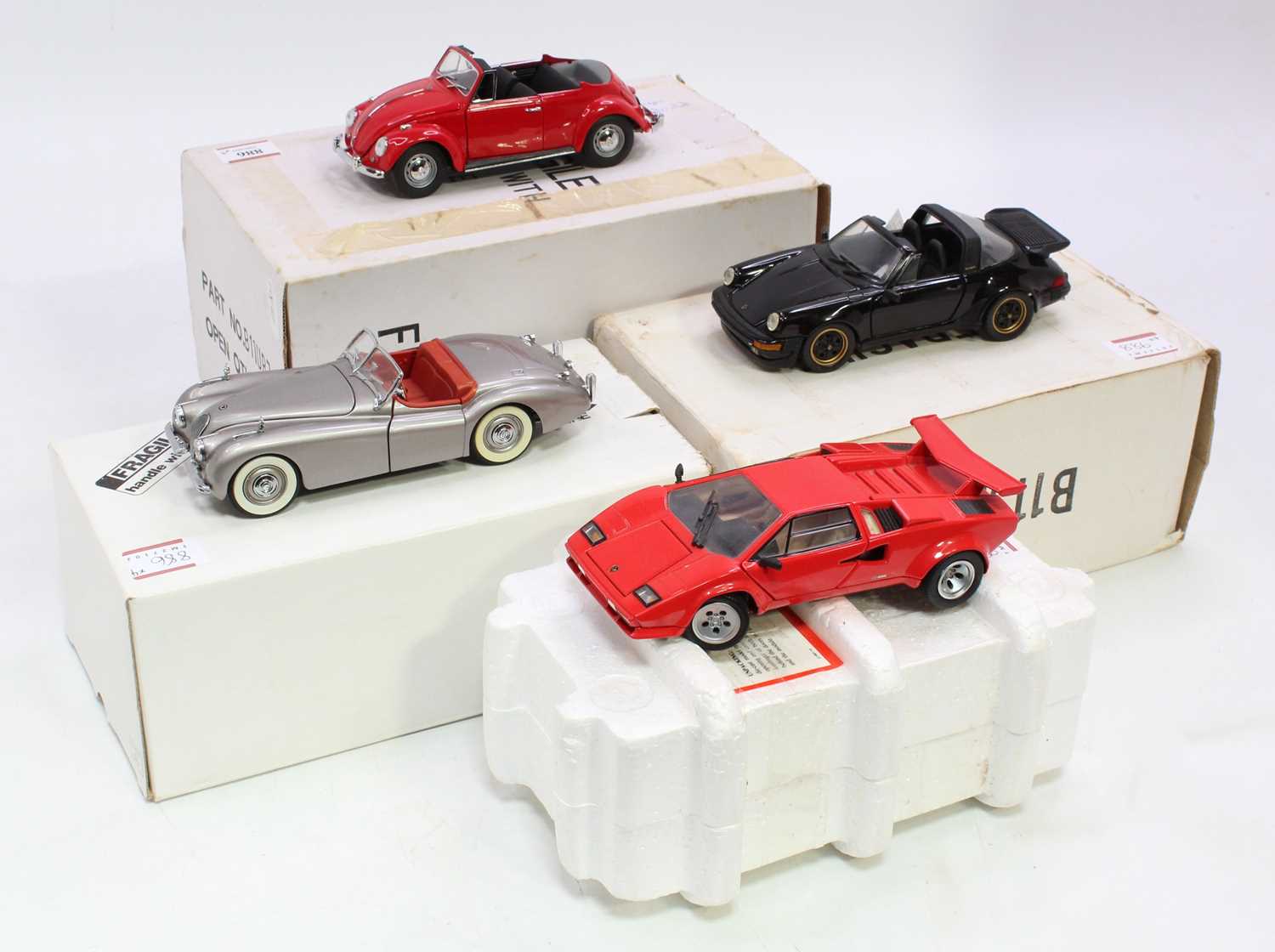 A collection of four various boxed Franklin Mint and Danbury Mint 1/24 scale diecast vehicles