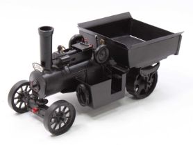 A scratchbuilt by Peter Day of Bury St Edmunds static tipping wagon, handpainted in black, with hand