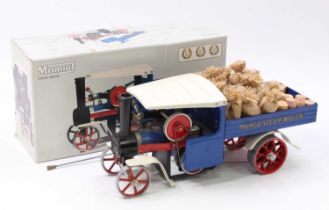 A Mamod SW1 live steam wagon of usual specification, comprising blue body with red chassis and white