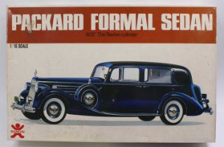 A Bandai No. 8069 1/16 scale plastic kit for a 1937 12-cylinder Packard formal sedan, model has been