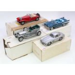 A collection of four various boxed 1/24 scale Danbury Mint and Franklin Mint diecast vehicles to