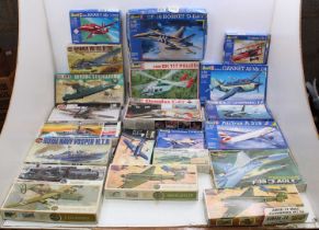 Two boxes containing a collection of various scale plastic military and aircraft kits to include