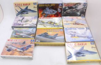 One box containing 11 various boxed as issued Italeri plastic aircraft kits to include an F-15C