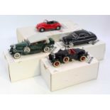 A collection of four various boxed Danbury Mint and Franklin Mint 1/24 scale diecast vehicles to