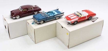 A collection of three Danbury Mint 1/24 scale diecast vehicles including 1948 Tucker Tin Goose, a