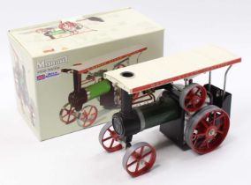 A Mamod Steam Tractor TE1A, green body, white roof, red wheels, the model is dusty from being on