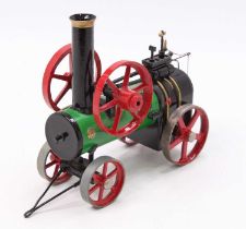 A scratch built and later adapted Mamod model of a portable live steam traction engine, similar to a