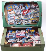 Two trays containing a quantity of various Hot Wheels, Star Wars and mainly TV related carded