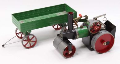 A Mamod spirit fired live steam road roller of usual specification, with matching four wheel