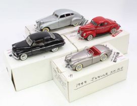 A collection of four various boxed 1/24 scale Danbury Mint diecast vehicles, to include a 1933